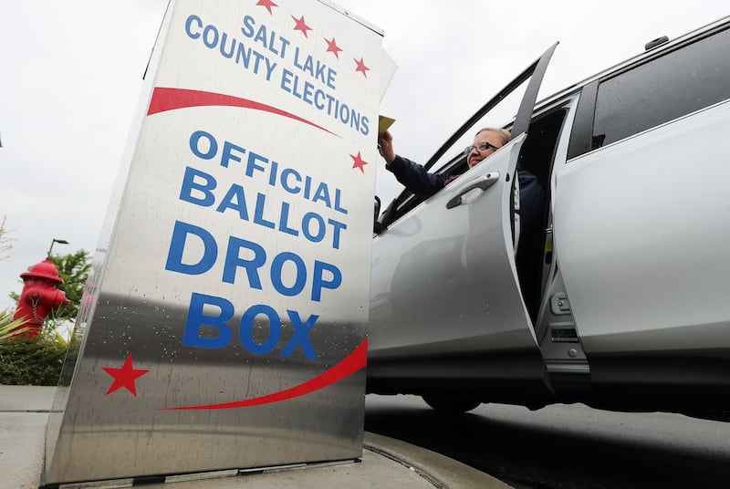 Melinda Tooley drops off her primary ballot at Midvale City Hall in Midvale.