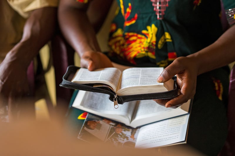 A woman studies the scriptures.