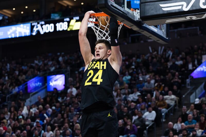 Utah Jazz center Walker Kessler (24) dunks the ball during an NBA game at Vivint Arena in Salt Lake City on Saturday, Feb. 25, 2023.