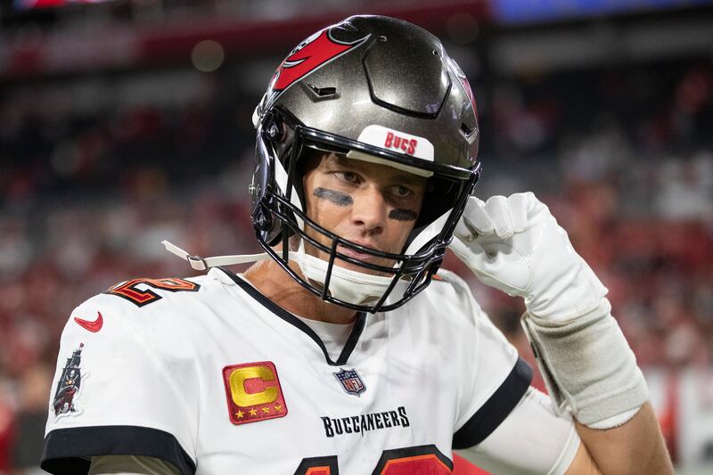 Tampa Bay Buccaneers quarterback Tom Brady unsnaps his chin strap after playing the Kansas City Chiefs, Sunday, Oct. 2, 2022 in Tampa, Fla.