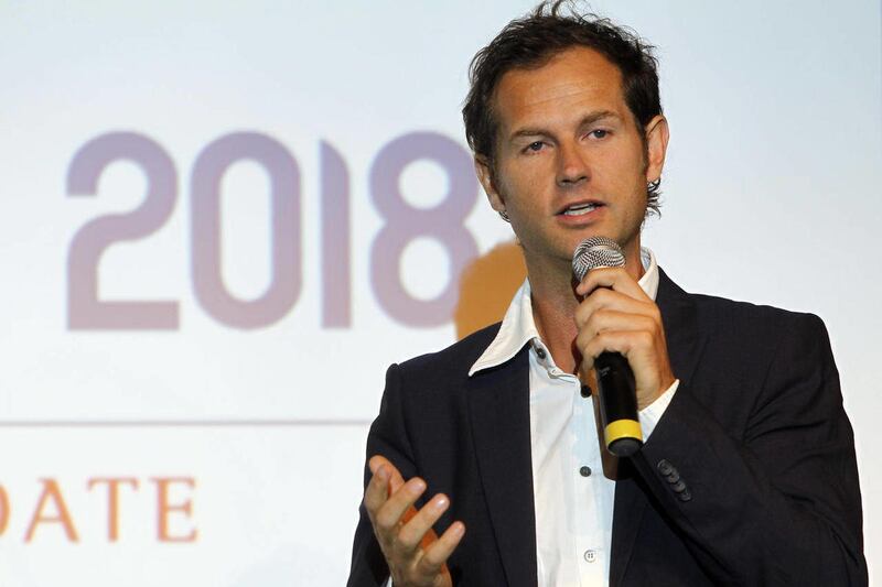 FILE - This is a Monday, Oct. 4, 2010 file photo of Edgar Grospiron, the then Chief Executive officer of the Annecy 2018 Bid Committee and former ski champion, presents the Annecy's 2018 winter Olympic bid during a press conference in Paris. Grospiron th
