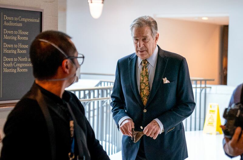 Paul Pelosi, husband of House Speaker Nancy Pelosi, follows his wife as she arrives for a news conference on Capitol Hill.