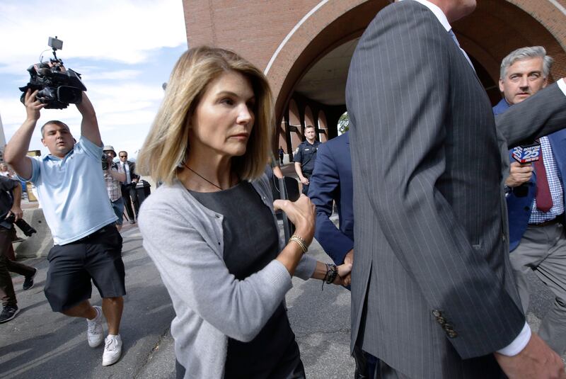 In this Aug. 27, 2019 file photo, actress Lori Loughlin departs federal court in Boston after a hearing in a nationwide college admissions bribery scandal.