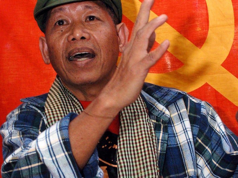 FILE - In this file photo taken Tuesday, Jan. 6, 2004, rebel spokesman Gregorio Rosal gestures as he talks to journalists during a clandestine news conference in a communist New People's Army encampment in northern Luzon, Philippines. The outlawed Communi