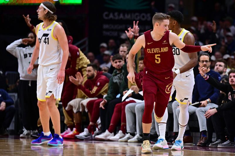 Cleveland Cavaliers guard Sam Merrill reacts after a 3-point basket against the Utah Jazz during the second half of an NBA basketball game Wednesday, Dec. 20, 2023, in Cleveland. (AP Photo/David Dermer)