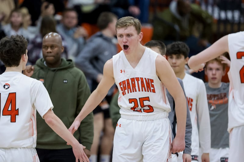 Murray’s Bowen Davies celebrates with teammates after their win over Springville in a 5A boys basketball second-round game.