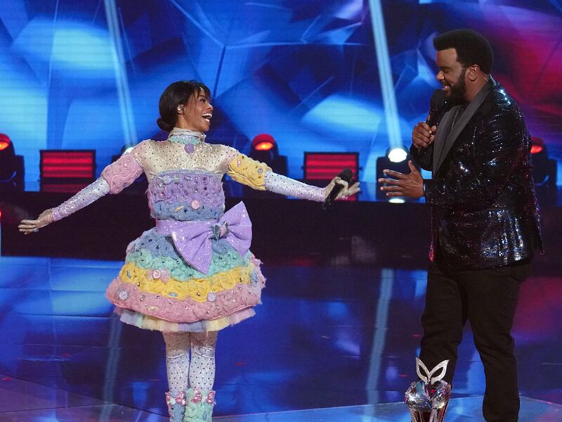 Gabby Douglas and host Craig Robinson on “The Masked Dancer.”