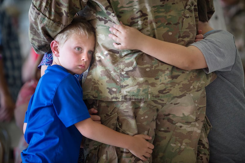 Jaxon Knudsen, 6, hugs his father James Knudsen of the Utah National Guard before he is deployed to the Middle East at the Roland R. Wright Air National Guard Base in Salt Lake City on Monday, June 4, 2018.