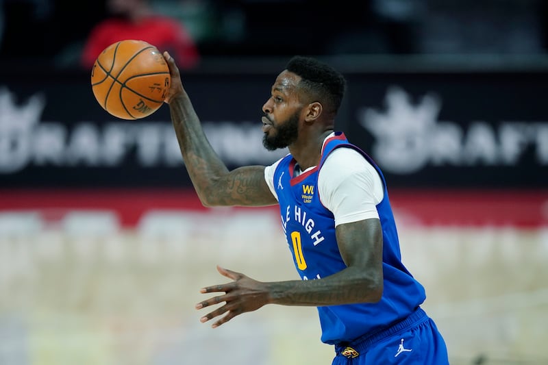 Denver Nuggets forward JaMychal Green takes the pass during the first half of an NBA basketball game against the Detroit Pistons, Friday, May 14, 2021, in Detroit.