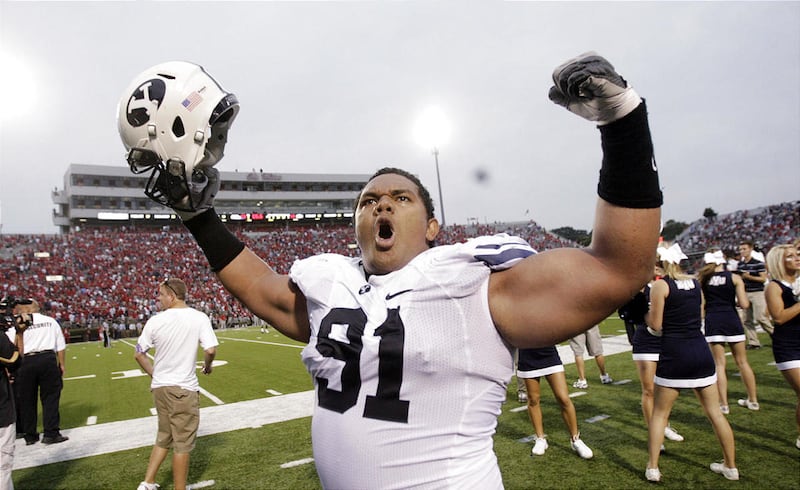 Brigham Young Cougars defensive lineman Hebron Fangupo (91) celebrates the win after the Cougar season opener with Ole Miss in Oxford, Miss Saturday, Sept. 3, 2011. BYU won 14-13.