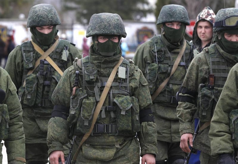 Pro Russian soldiers guard Ukraine’s infantry base in Perevalne, Ukraine, Tuesday, March 4, 2014.