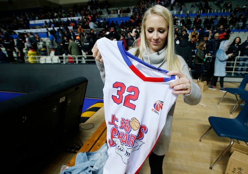 Whitney Fredette holds her husband Jimmer's jersey after a game in Shanghai, China, on Jan. 21, 2018. Freddette is a former BYU Cougar and now plays for the Shanghai Sharks in the Chinese Basketball Association.