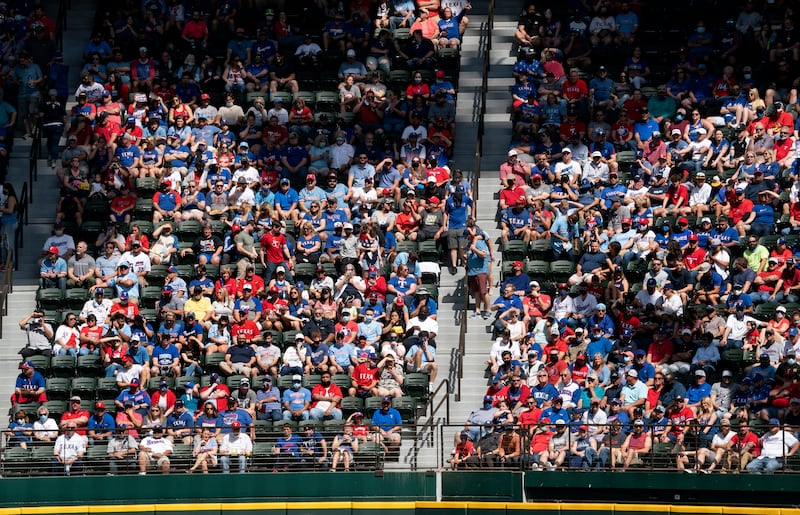 Fans fill the stands at Globe Life Field during the first inning of a baseball game between the Texas Rangers and the Toronto Blue Jays, Monday, April 5, 2021, in Arlington, Texas.