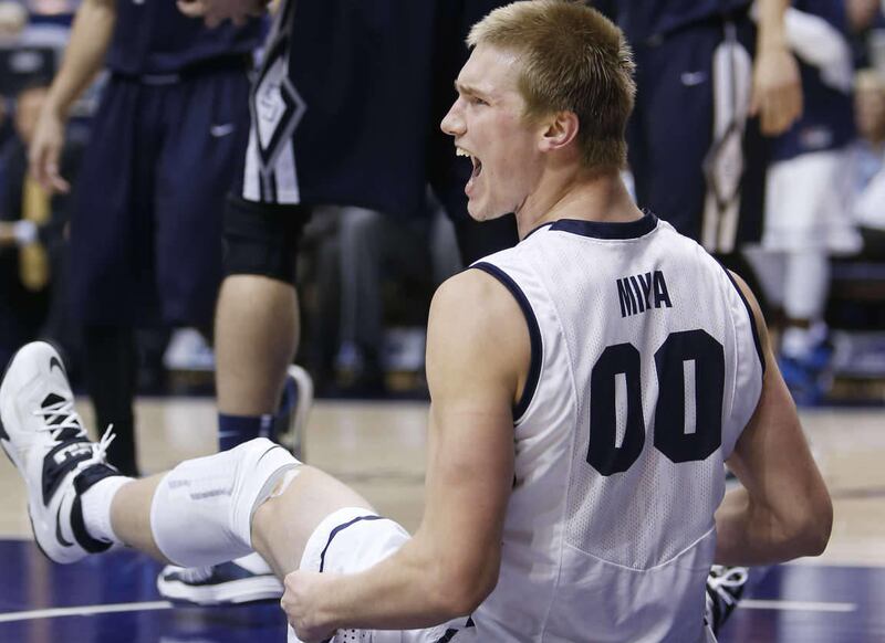 Brigham Young Cougars center Eric Mika yells after a slam dunk during NCAA action in Provo Saturday, Jan. 4, 2014.