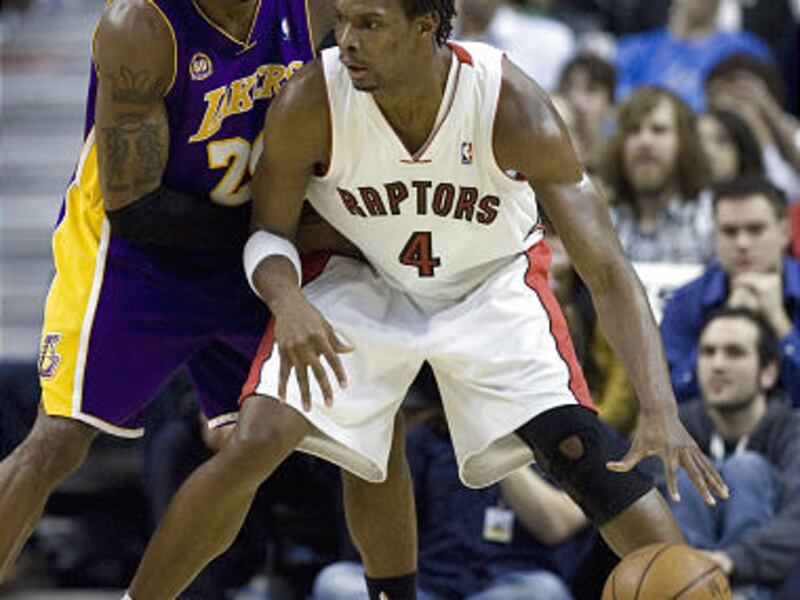 Los Angeles Lakers forward Kobe Bryant, left, guards Toronto Raptors forward Chris Bosh during the second-half Friday night.