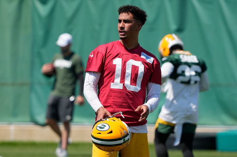 Green Bay Packers QB Jordan Love runs a drill during an NFL minicamp. Love took first-team reps with Aaron Rodgers holding out.