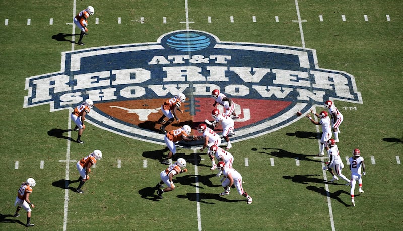 Oklahoma, right, runs a play against Texas in the an NCAA college football game at the Cotton Bowl, Oct. 12, 2019, in Dallas.