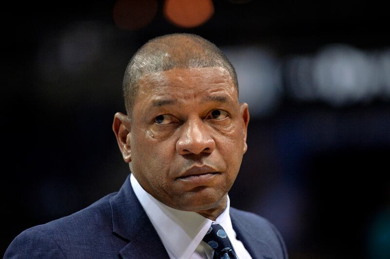 FILE - In this Dec. 5, 2018 file photo, Los Angeles Clippers head coach Doc Rivers stands on the court in the first half of an NBA basketball game against the Memphis Grizzlies in Memphis, Tenn.