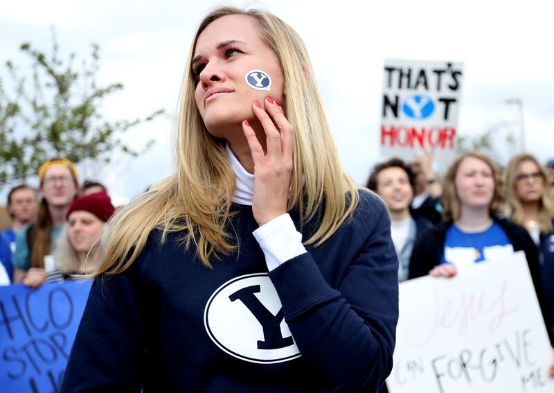 Sidney Draughon, who started an Instagram campaign asking people to share their experiences with BYU's honor code, looks at the hundreds who gathered for a demonstration on the Provo campus on Friday, April 12, 2019.