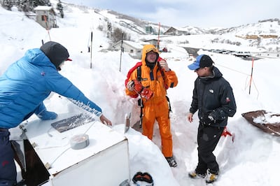 Colin Little, a wilderness medicine fellow at the University of Utah, removes gear and sensors after being buried in snow for an hour to test the effectiveness of the Black Diamond JetForce air bag at the Utah Olympic Park in Park City on Monday, March 11