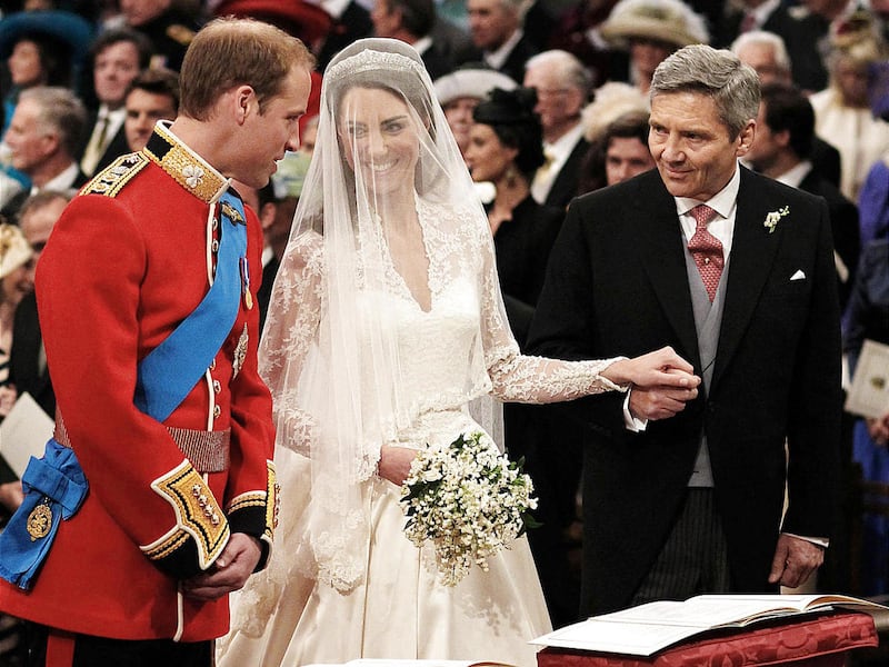 Prince William greets Kate Middleton as she arrives at the alter with her father Michael Middleton, prior to their marriage in London's Westminster Abbey, Friday April 29 2011.