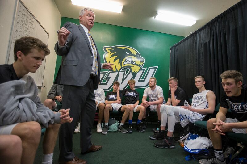 Orem head coach Golden Holt speaks to the team following a 71-56 victory against Desert Hills in the Class 4A state quarterfinals at Utah Valley University in Orem on Thursday, March 1, 2018.