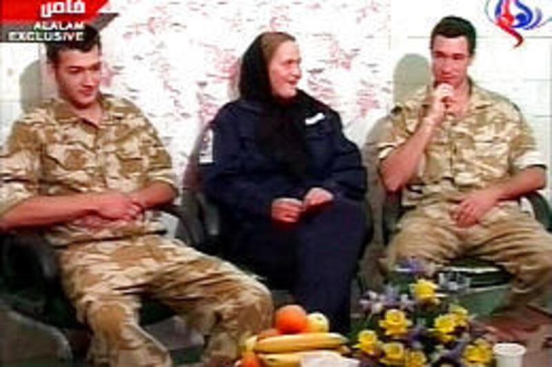 Three British service personnel appear on Iranian state television Friday. Nathan Thomas Summers, left, Faye Turney and a man believed to be Adam Sperry were among 15 British sailors and marines seized by Iranian naval units on March 23.