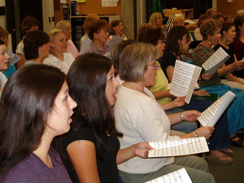 Wasatch Chorale singers rehearse for their upcoming concerts.
