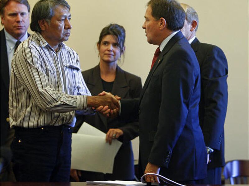 Rupert Steele, left, chairman of Confederated Tribes of the Goshute, shakes hands with Gov. Gary Herbert after the signing of the Deed of Conservation Easement.