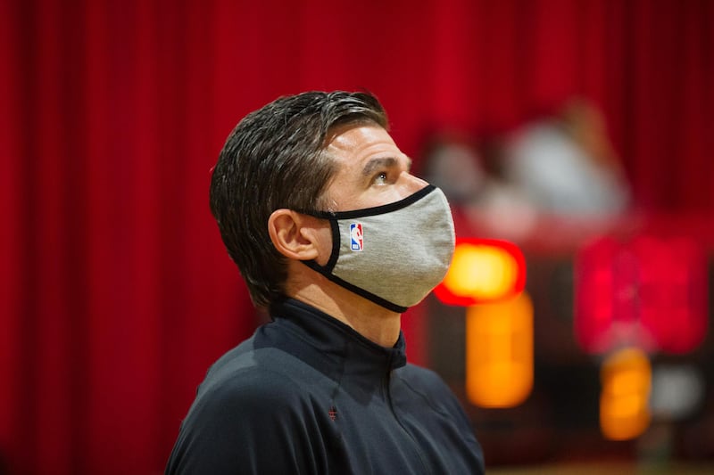 Scott O’Neil, 51, head coach for The Pennington School girls varsity basketball team, watches warmups in Pennington, N.J., on Monday, Dec. 6, 2021.