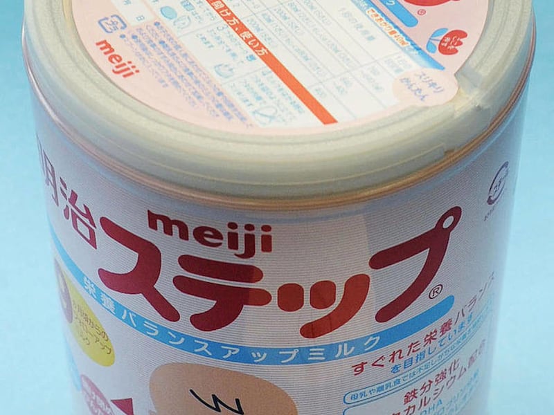 In this photo taken Tuesday, Dec. 6, 2011, a canned powdered milk for infants Meiji Step, manufactured and sold by Japan's major food and candy maker Meiji Co., is shown. Traces of radiation spilled from the hobbled Japanese nuclear plant were detected in