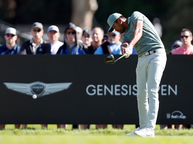 Tony Finau hits his tee shot on the second hole during the final round of the Genesis Open golf tournament at Riviera Country Club Sunday, Feb. 18, 2018, in the Pacific Palisades area of Los Angeles. (AP Photo/Ryan Kang)