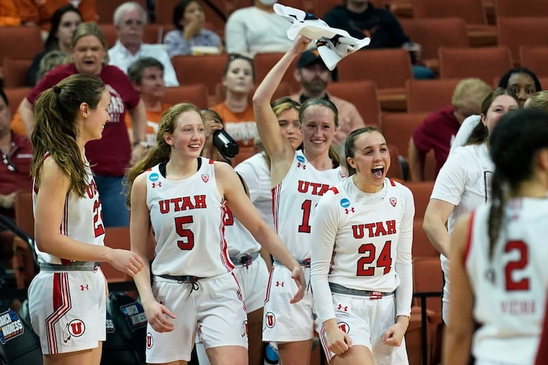 Utah guard Gianna Kneepkens (5), guard Kennady McQueen (24) and teammates celebrate their win over Arkansas in the first round of the NCAA women’s tournament. The No. 7 seed Utes will face No. 2 seed Texas on Sunday, March 20, 2022, in a second-round game.