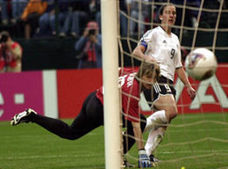 Goaltender Alla Volkova watches a goal kicked by Germany's Birgit Prinz hit the net. Prinz scored two goals within eight minutes. Germany will play the U.S. on Sunday.