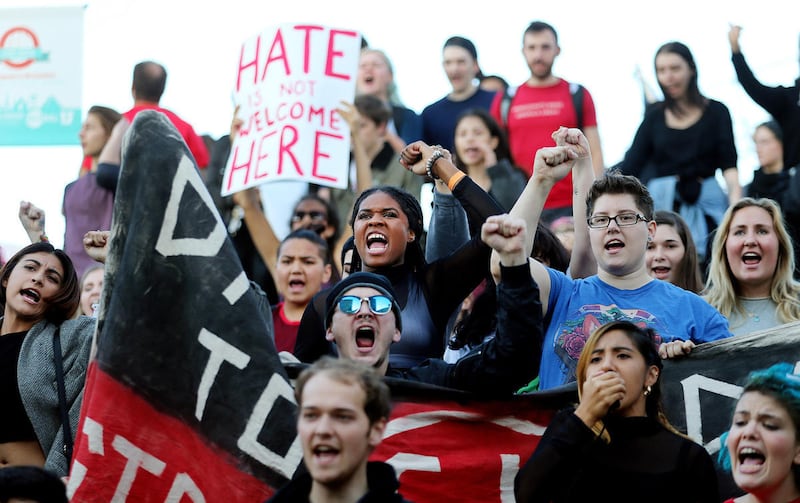 Emalee Egelund, center, joins other protesters chanting and yelling as they march toward the building where conservative commentator Ben Shapiro was to speak at the University of Utah in Salt Lake City on Wednesday, Sept. 27, 2017.