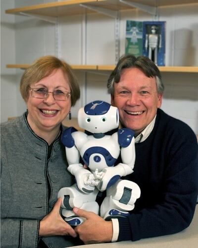 Susan and Michael Anderson with NAO, a robot they've programmed to make ethical decisions about elder care.