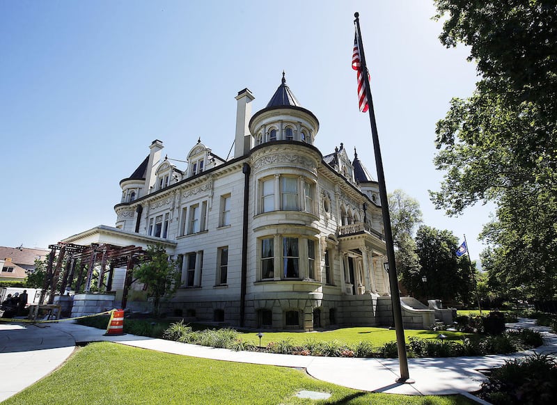Crews repair a porch on the Governor’s Mansion in Salt Lake City, Thursday, June 5, 2014.