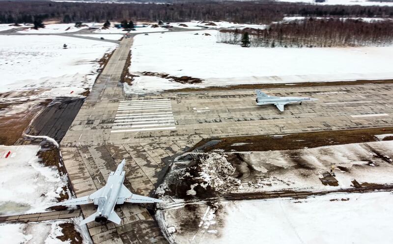 In this photo taken from video and released by the Russian Defense Ministry Press Service on Saturday, Feb. 5, 2022, A pair of Tu-22M3 bombers of the Russian air force taxi before takeoff at an air base in Russia. Two Tu-22M3 long-range bombers of the Russian air force performed a patrol mission over Belarus on Saturday amid the tensions over Ukraine.