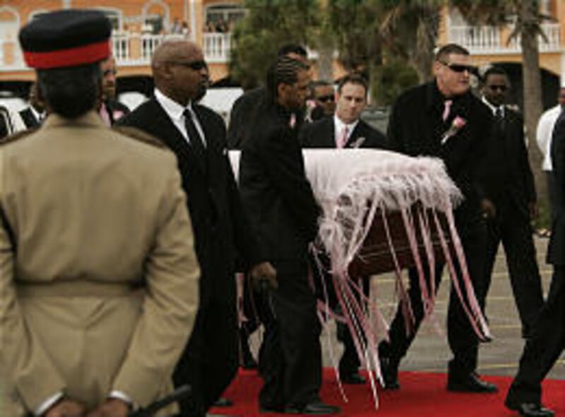 The coffin carrying Anna Nicole Smith's body is brought into the church in Nassau for her funeral, three weeks after she died.