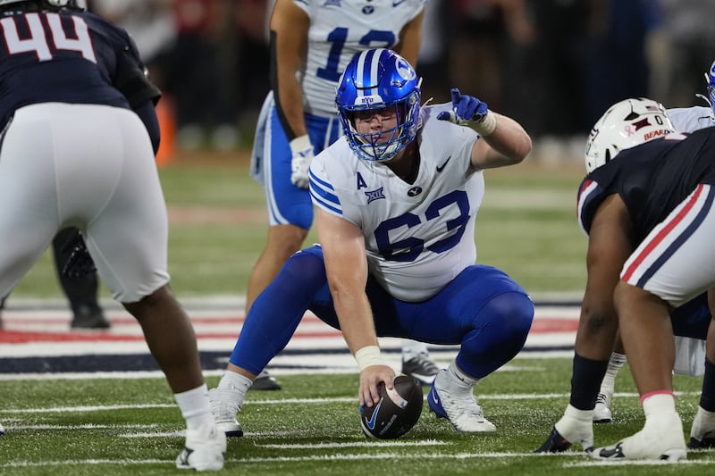 BYU offensive lineman Bruce Mitchell (63) barks out assignments during game against Arizona, Saturday, Oct. 11, 2025, in Tucson, Ariz.