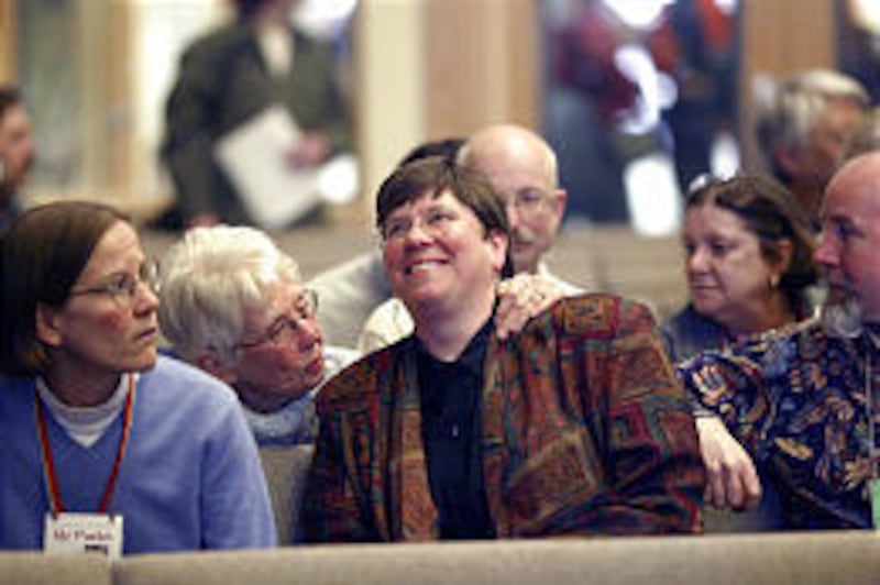 Rev. Karen Dammann, a lesbian Methodist pastor, is congratulated by some of her parishioners after being acquitted in a church trial over her sexual orientation.