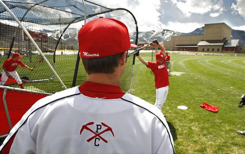 Caleb Figge and teammates from Park City High School warm up before a baseball game on Tuesday against Uintah High School.