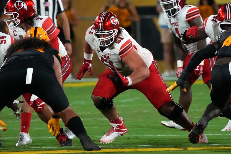 Utah offensive lineman Keaton Bills fires off during game against Arizona State, Saturday, Sept. 24, 2022, in Tempe, Ariz.