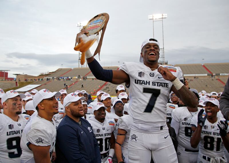 Utah State cornerback DJ Williams celebrates after being named the Outstanding Defensive Player of the New Mexico Bowl NCAA college football game in Albuquerque, N.M., Saturday, Dec. 15, 2018. Utah State beat North Texas 52-13. (AP Photo/Andres Leighton)