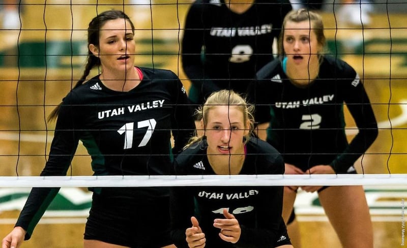 Utah Valley's Lexi Thompson (left), Madison Dennison (center) and Sierra Starley (right) await a serve in a home match against Utah State at the UCCU Center last season. The trio of 2017 seniors were each named Preseason All-WAC on Wednesday.