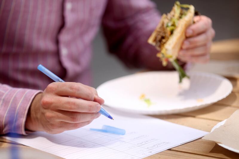 Court Mann scores a burger as he taste tests at the Deseret News office in the Triad Center in Salt Lake City on Tuesday, Aug. 6, 2019.