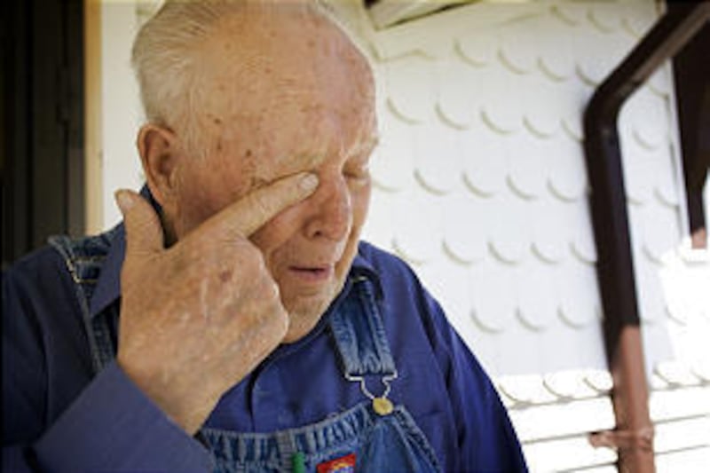 Guy Hersh wipes tears from his eyes as he talks about his older brother, Tom Hersh, who was killed in the Wilberg Mine disaster.