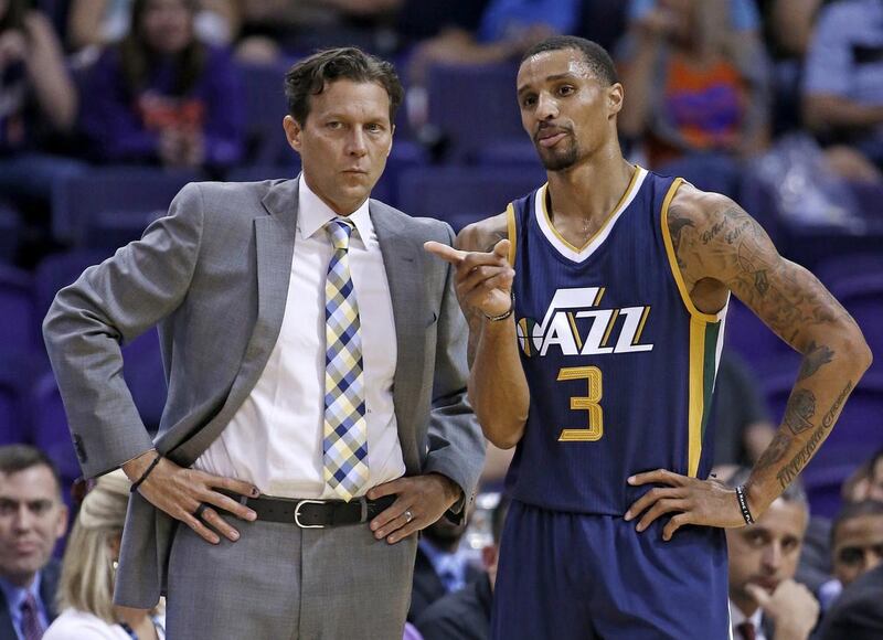 Utah Jazz's George Hill (3) talks with head coach Quin Snyder, left, during the first half of an NBA preseason basketball game against the Phoenix Suns Wednesday, Oct. 5, 2016, in Phoenix. The Jazz defeated the Suns 104-99. (AP Photo/Ross D. Franklin)