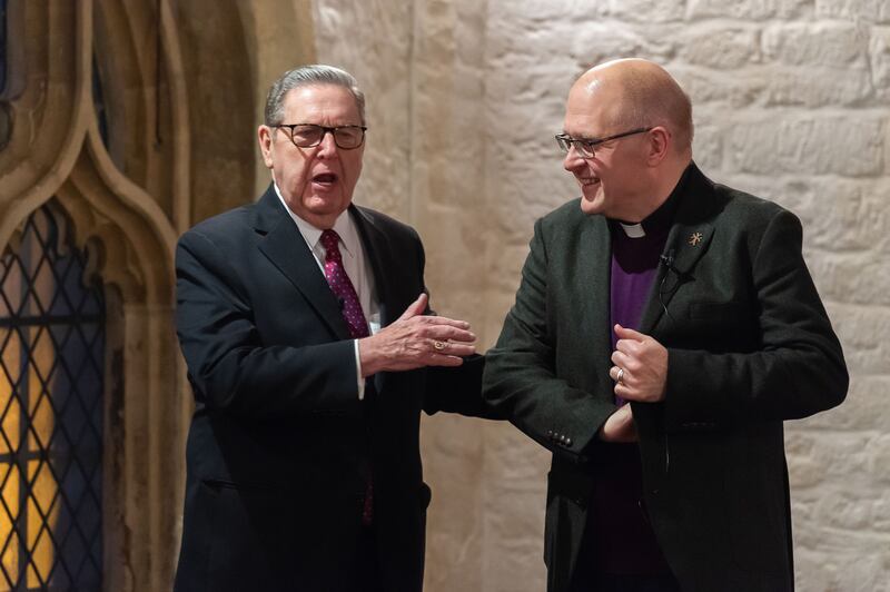 Elder Jeffrey R. Holland shares a light moment with the Rev. Dr. Andrew Teal during a public conversation.