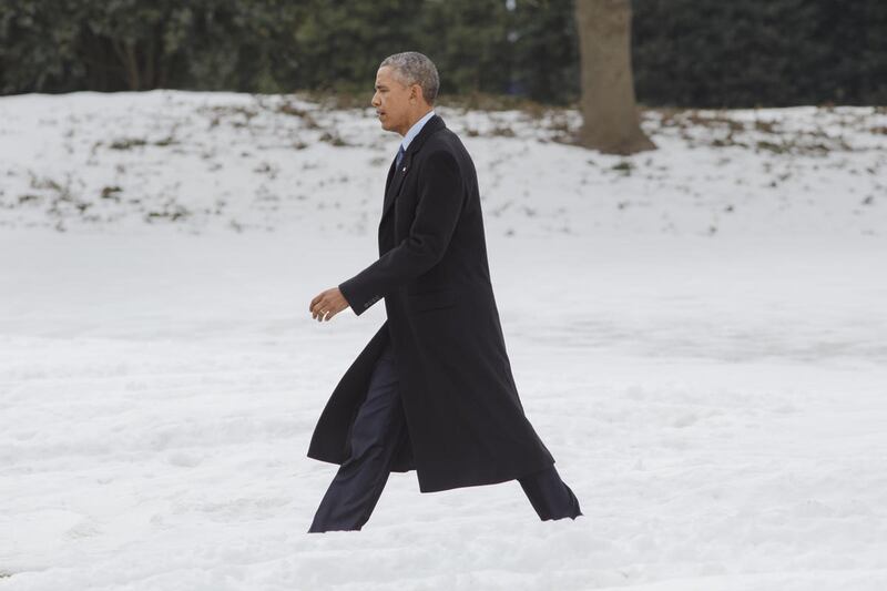 President Barack Obama walks on the South Lawn of the White House in Washington, Wednesday, Feb. 25, 2015, to board Marine One for a short flight to Andrews Air Force Base, then on to Miami where he will participate in a town hall style meeting at Florida